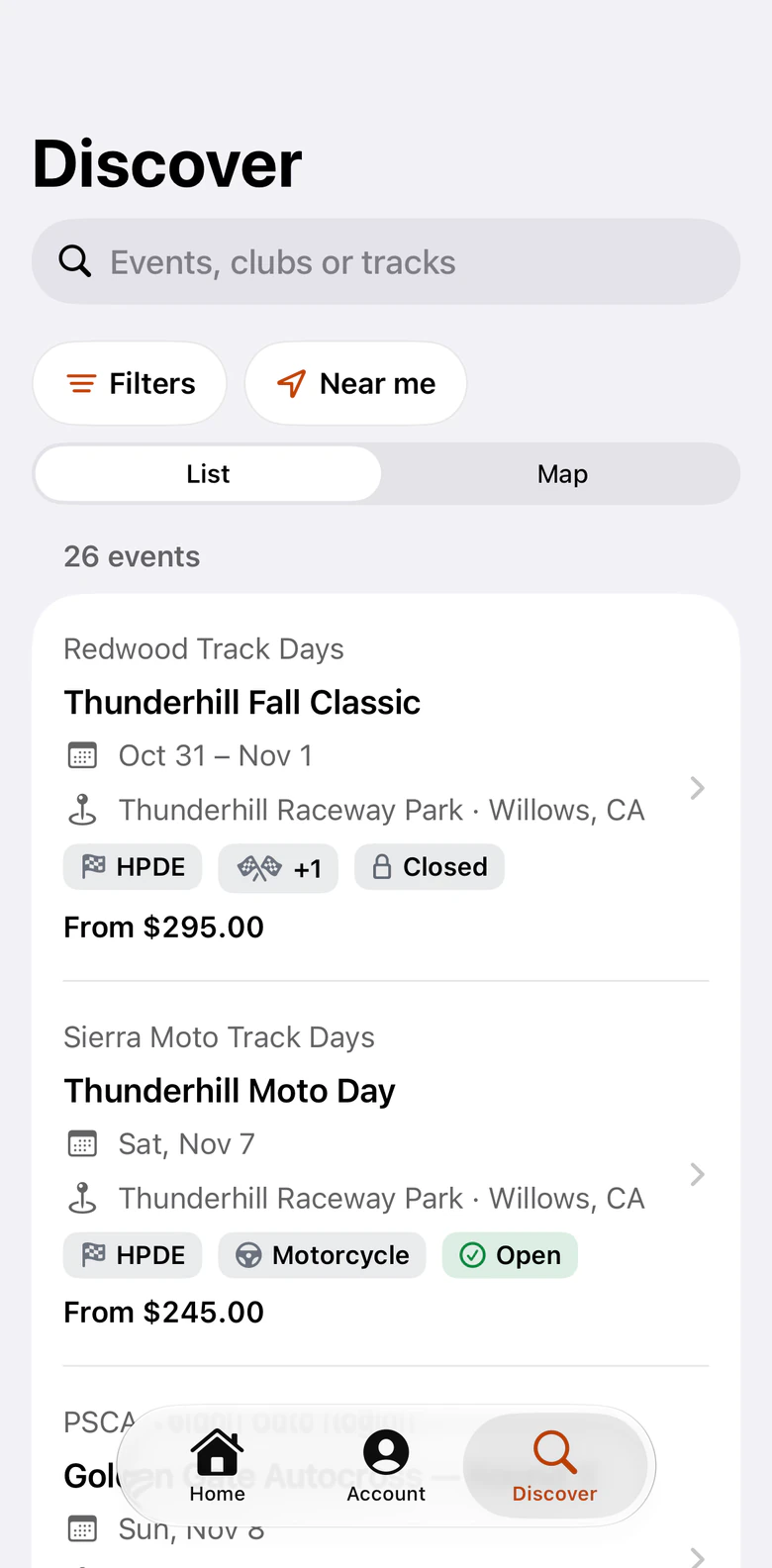 The Discover tab of the trackReg iPhone app: a search box for events, clubs or tracks, Filters and Near me buttons, a list and map switch, and 26 events with their club, dates, track, discipline, availability and starting price.